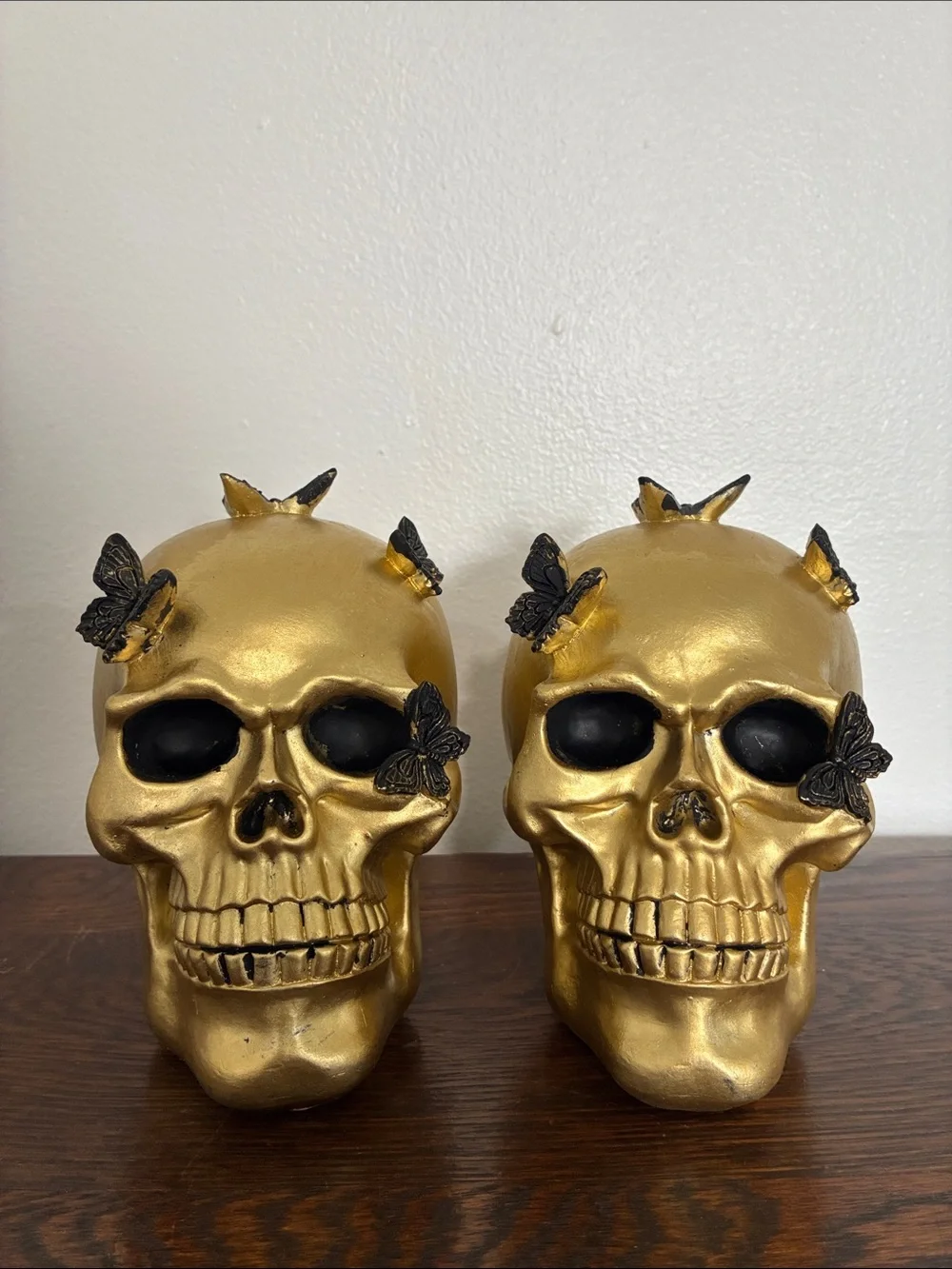 NWT- Set of 2- STUNNING- Gold Skull Statues with Black Butterflies Accents